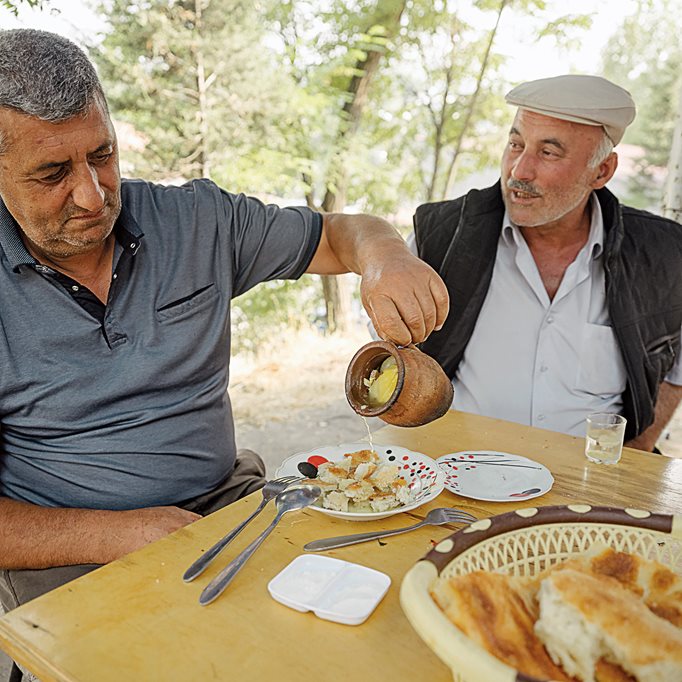 In the town of Dashkasan, men share a dish of piti, a traditional stew. Chickpeas, dried plums and a diced leg of lamb are covered in a layer of sheep fat and slow-cooked. A sprinkle of saffron is added just before serving, and it’s often scooped up with fresh bread.