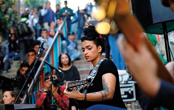 Egyptian singer and ‘ud player Bal Qeis performs at a free street concert near Shamasi stairs in Amman, Jordan, during the capital city’s annual jazz festival. 