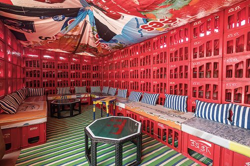 Hassan Hajjaj Full of brilliant colors and objects from custom-made crafts to recycled bottle crates and other “found objects,” Riad Yima in Marrakesh serves as one of Hajjaj’s two retail boutiques as well as a cafe 
and gallery.