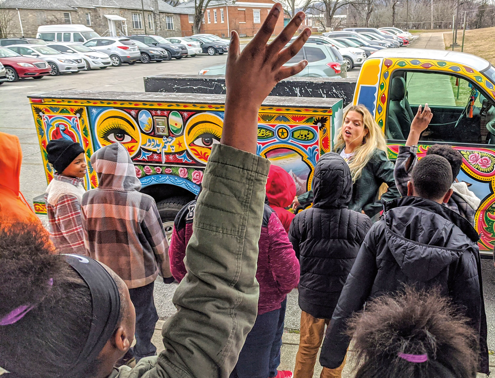 Colors decorate every visible bit of the truck and include scenes that represent both Pakistan and Tennessee and help students, like those in this class at Orchard Knob Elementary School, enjoy making cultural connections.