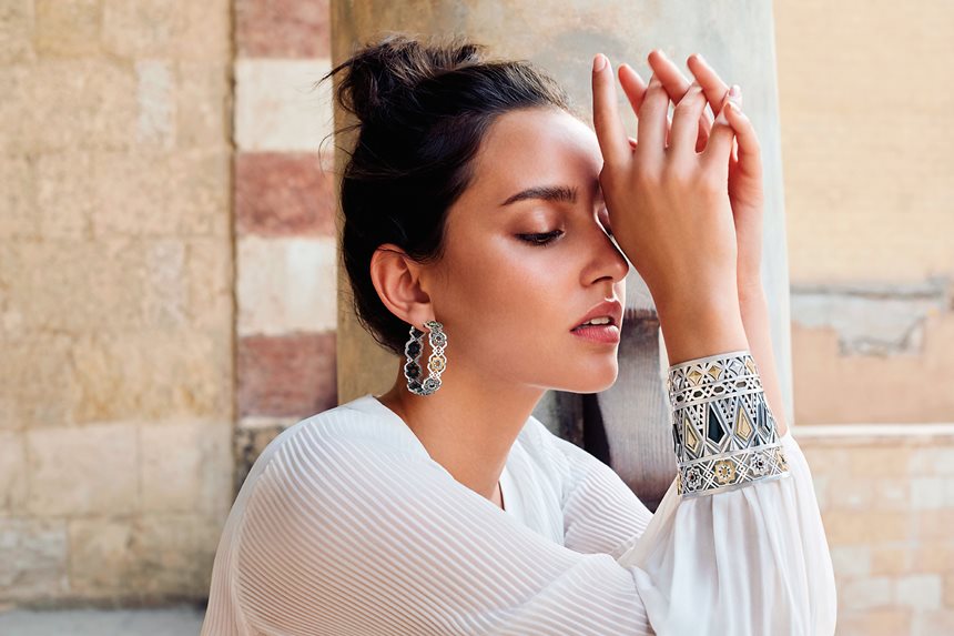 A model wearing the Qalawun cuff and Mamluk Star earring from the Mamluk-era inspired collection titled “Culture ‘20.” In her collection “The Golden Age of Love Songs,” Fahmy commemorates the romantic-era of Arabic songs from the ‘60s through the ‘90s. Each piece is inspired and named after an artist with lyrics crafted into each piece. 