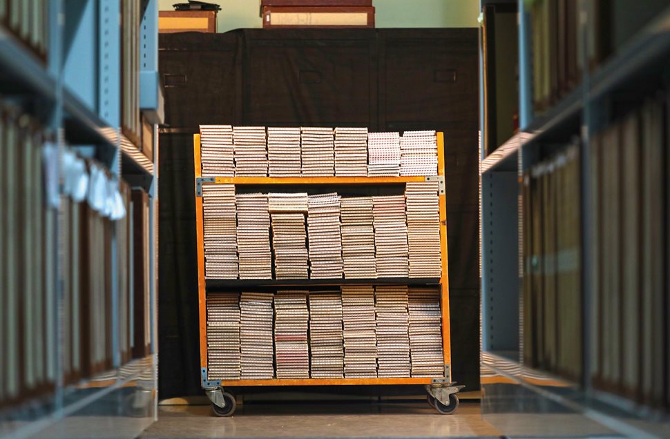 A cart loaded with roughly half Shadid’s 650 reporter’s notebooks, right, is part of Shadid’s archives currently on loan from his family to the American University of Beirut for research and study.