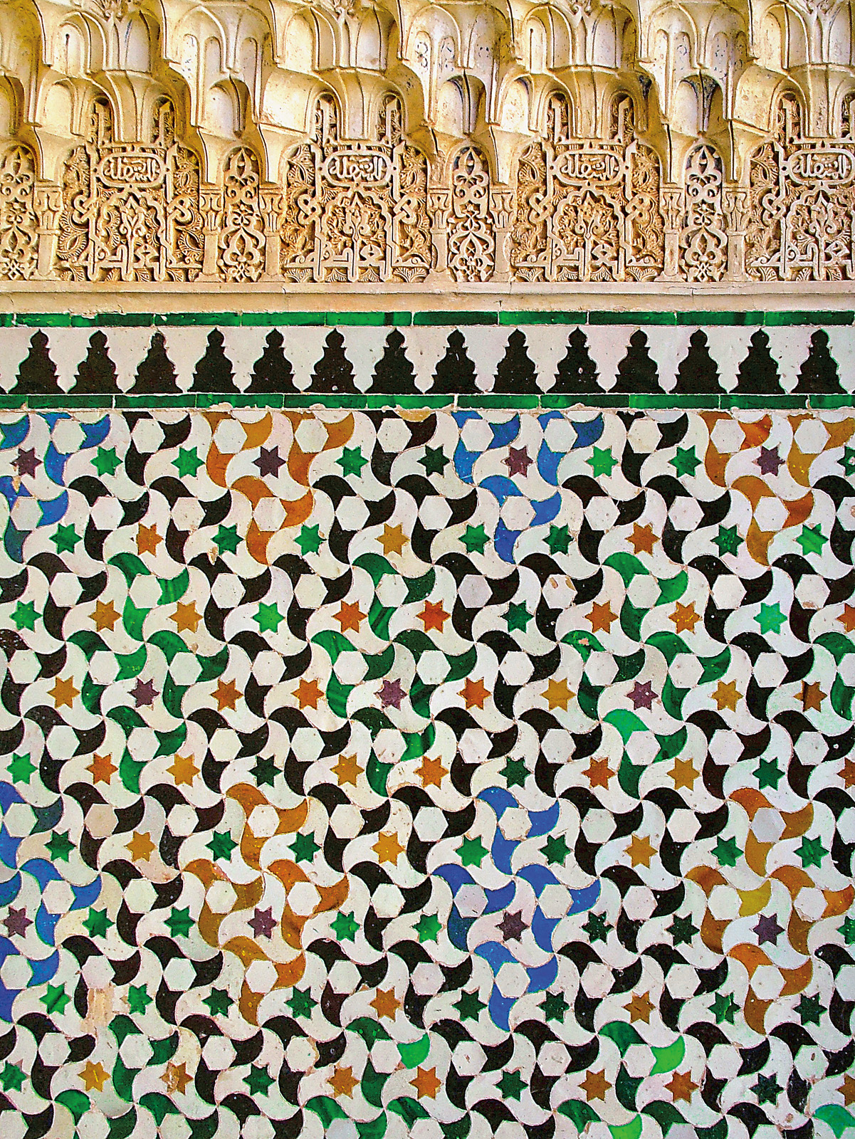 Multicolored tiles seem to twirl through space in this <i>alicatado</i> (cut-tile) pattern produced in the 14th century by Nasrid artisans on a wall of the Court of the Myrtles in the Alhambra palace in Granada, Spain. The Arabic root of the Spanish alicatado is <i>al-qata</i>, &ldquo;the cut.&rdquo; &nbsp;