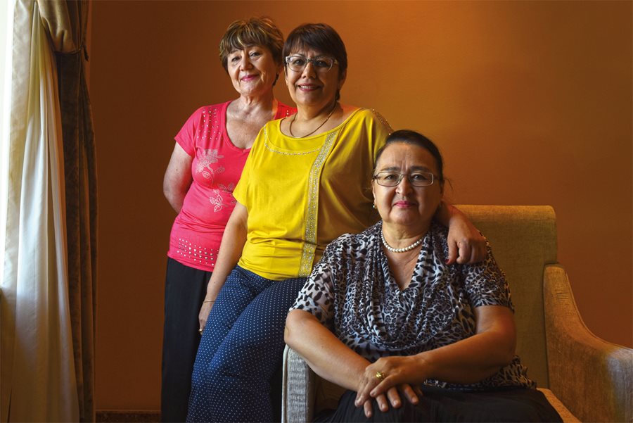 <p><em>Above: </em>Participants in the first teacher exchanges to Seattle between 2004 and 2006, Fatima Tashpulatova, Zukhra Miliyeva and Zukhra Salikhodjaeva came from Tashkent School 17, where a former administrator, <em>below, right</em>, holds a Seattle souvenir as a reminder of the relationships that grew among teachers in the sister cities. In addition to bringing home lesson plans from Seattle they still use, “we also shared our teaching methods,” explains Tashpulatova, “and we told them everything about our traditions, customs and habits.”</p>