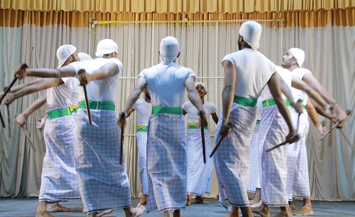 Combining dance with intense percussive rhythms, kolkali (stick dance) involves performers swaying, swinging and interweaving while clacking heavy sticks in complex musical patterns.