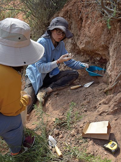 Collecting samples, Basira Mir-Makhamad digs in a settlement in Juuku, Kyrgyzstan. 