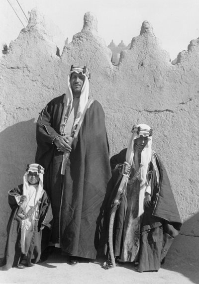 Posing at the top of the palace, Amir Saud ibn Abdulaziz—later King Saud—stands with his sons Muhammad, left, and Fahd. 