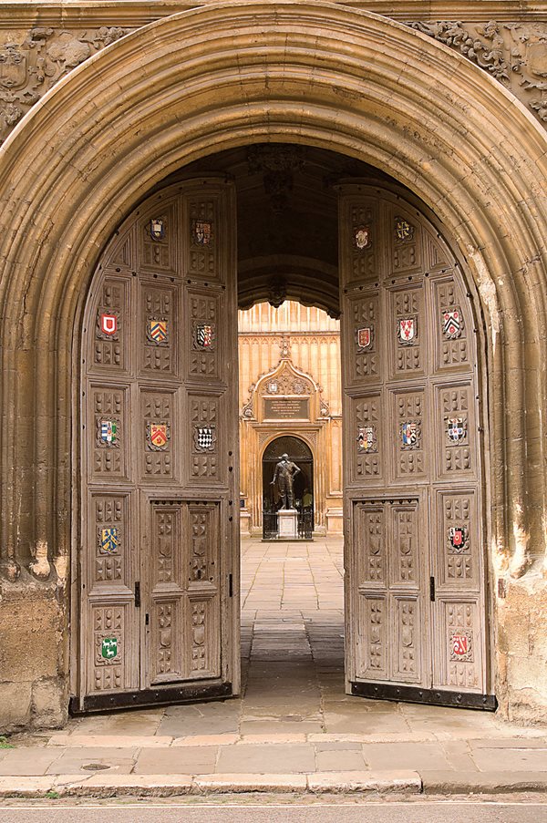 Doors open into the courtyard of the Bodleian Library, founded in 1601.