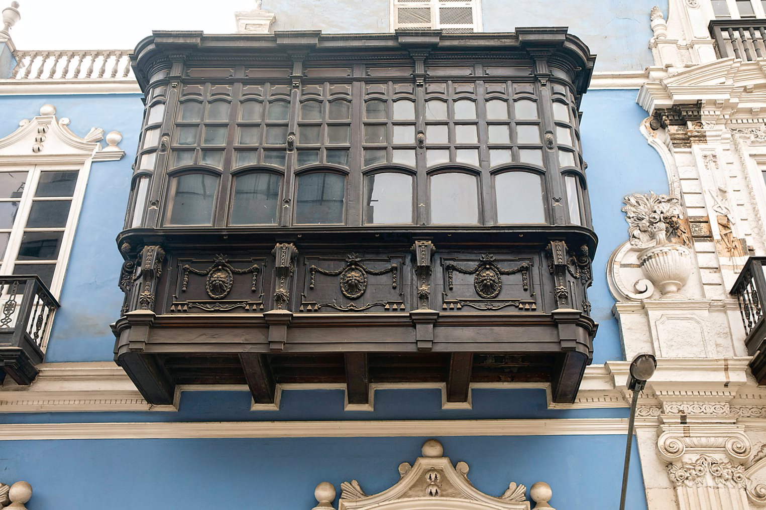 Built at the turn of the 19th century by a Spanish merchant and recently restored, the balconies along the facade of the Casa Osambela reflect an entirely European, neoclassical style. 