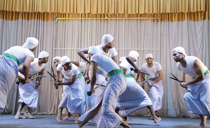 Combining dance with intense percussive rhythms, kolkali (stick dance) involves performers swaying, swinging and interweaving while clacking heavy sticks in complex musical patterns.