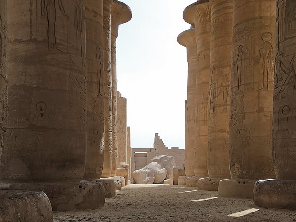 Another fallen statue of Ramses lies at the end of what was once a covered, hypostyle hall in the Ramesseum.