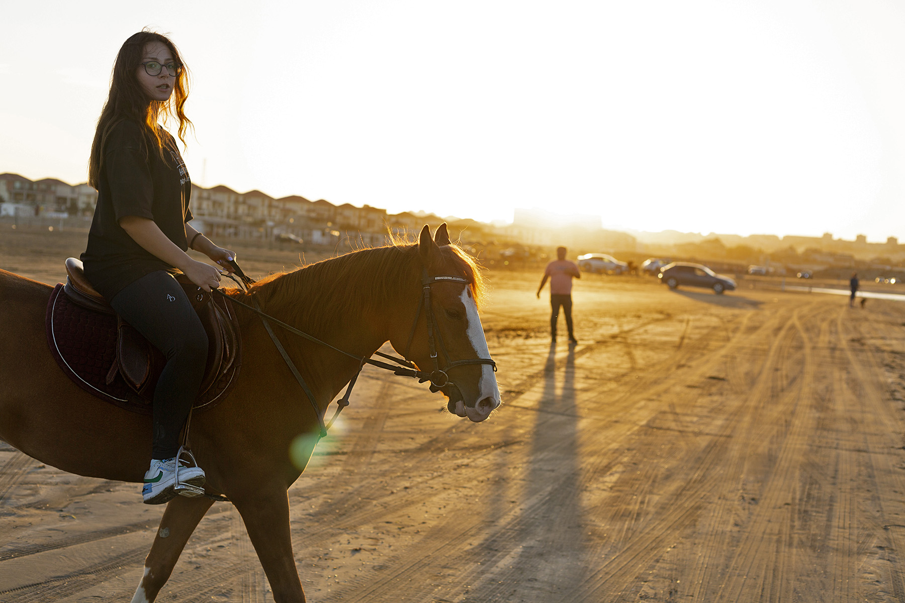 Buta, an 11-year-old purebred Karabakh mare, trots along the shore of the Caspian Sea near Baku, Azerbaijan. In the saddle is Lala Aghayeva, a recreational rider and member of the Baku Golden Horse Club. 