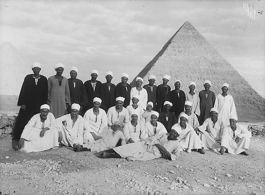 Of the 9,000 images now archived under his name, there is only one that may show Ibrahim himself: Researchers believe that he may be the man reclining in the center of this 1938 shot of the archeology team at the Harvard Camp in Giza. 