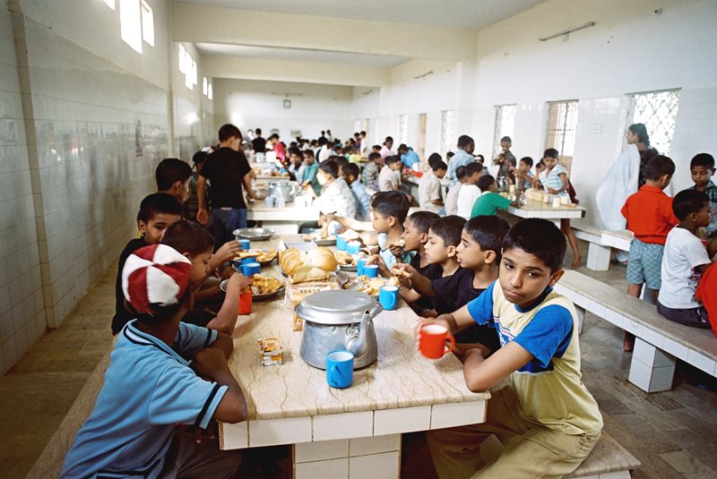 Breakfast at the Edhi Child Home is well-organ&shy;ized; the boys rotate the responsibilities of cooking, serving and cleaning.
