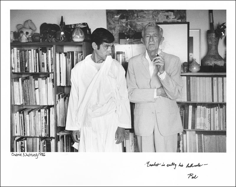 &ldquo;Nobody taught me anything,&rdquo; says Mrabet, whom Bowles regarded as &ldquo;a virtuoso storyteller.&rdquo; In this 1986 photo, the two stand in Bowle&rsquo;s library in Tangier. <em>Background</em>: Evening in Tangier.
