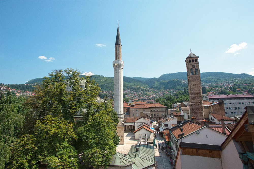 <p>To the east of the new Gazi Husrev-beg Library, which opened in 2014, lies the library’s first home, in the 16th-century mosque-and-madrasa complex built by Husrev-beg. The hills surrounding the city, which held snipers during the Siege of Sarajevo, are today a postcard backdrop to Sarajevo’s old city.</p>
