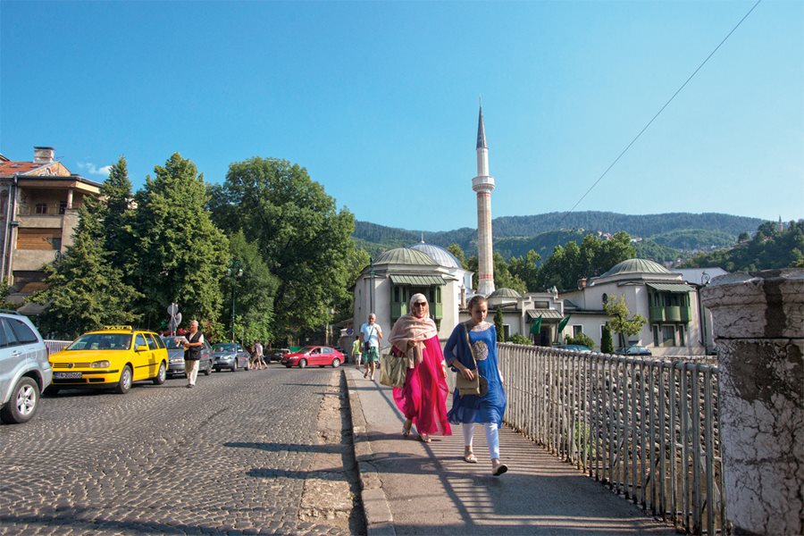 <p>Sarajevans walk north across the Emperor’s Bridge, the same route Jahić and his team took under the guns of snipers. The Sultan’s Mosque, the library’s home from 1935 until 1992, stands in the background.</p>
