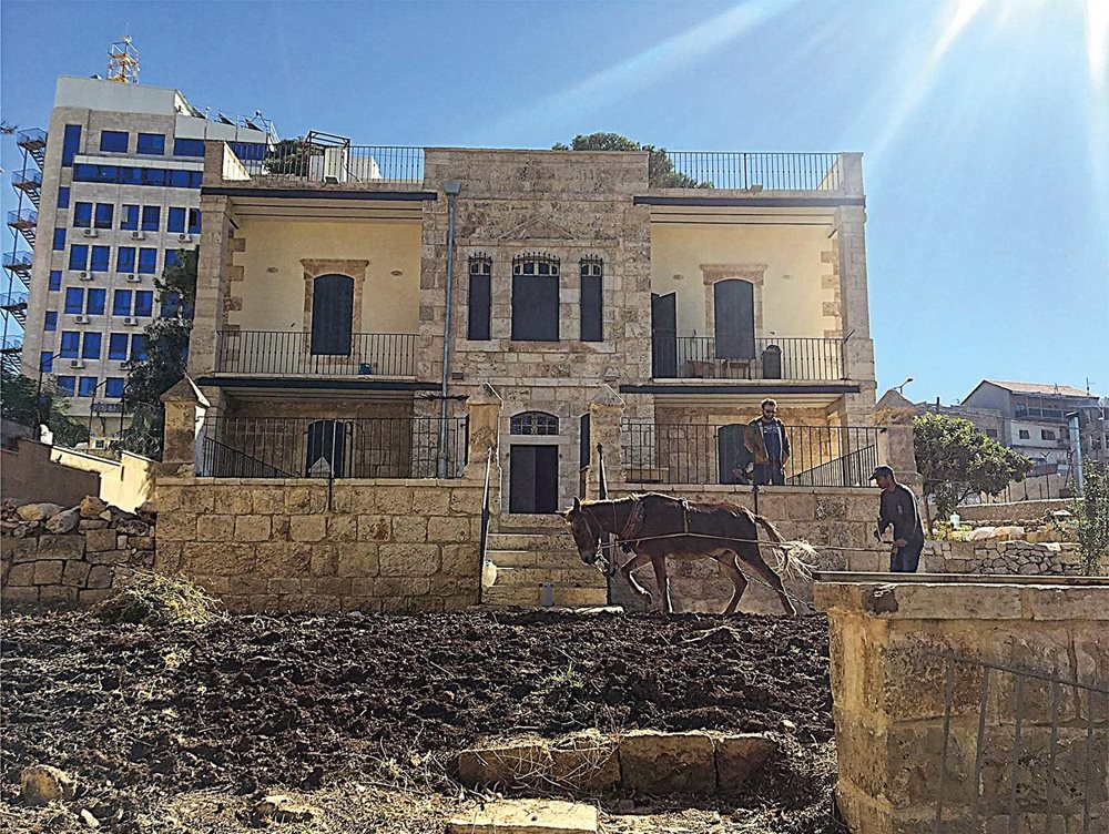 In this 2018 photo, a horse pulls a plough to till the soil in Dar Jacir’s garden—much as it might have been done a century ago.