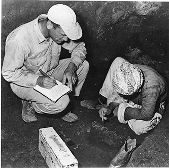 In June 1953, while a member of his team gingerly uncovers bones of a Neanderthal child, Ralph Solecki makes notes of the first Neanderthal discoveries in Shanidar Cave. 