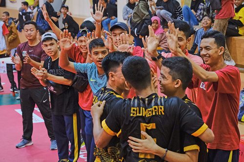 West Sumatra sepak takraw student team members celebrate victory over Jakarta province at popnas xv.