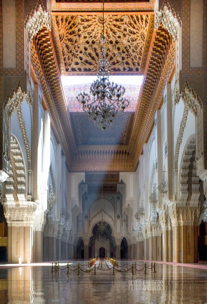 Sanders snapped this photograph of Hassan II Mosque in Casablanca, Morocco, in April 2012. It took two weeks to organize; the carpets were removed, the 100-foot titanium doors and sliding roof were opened, tourists and worshipers were vacated. The photo itself took an eighth of a second to shoot.
