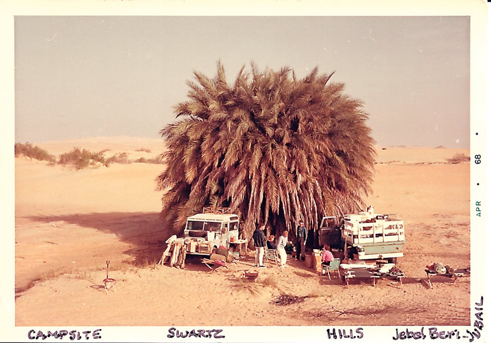<p>A personal album photo shows the Swartz and Hills families, camped in the available shade near Jabal Berri (“Mt. Berri”) in the Jubail region in the northeast of Saudi Arabia. “When we started our desert excursions and artifact collecting, the kingdom was not yet focused on discovering and preserving archeological sites,” said Swartz. “We felt we were saving them for eventual recognition.”</p>