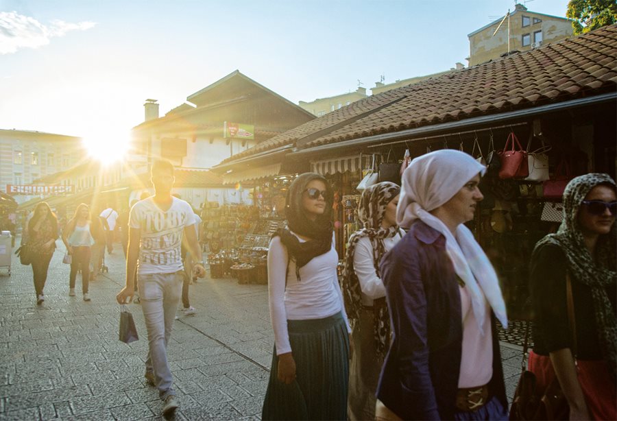 <p>Strollers throng Sarači Street, a pedestrian thoroughfare in the Baščaršija that runs east-west through hundreds of years of the city’s history. The new Gazi Husrev-beg Library, and its original location at the Kursumlija, are nearby.</p>
