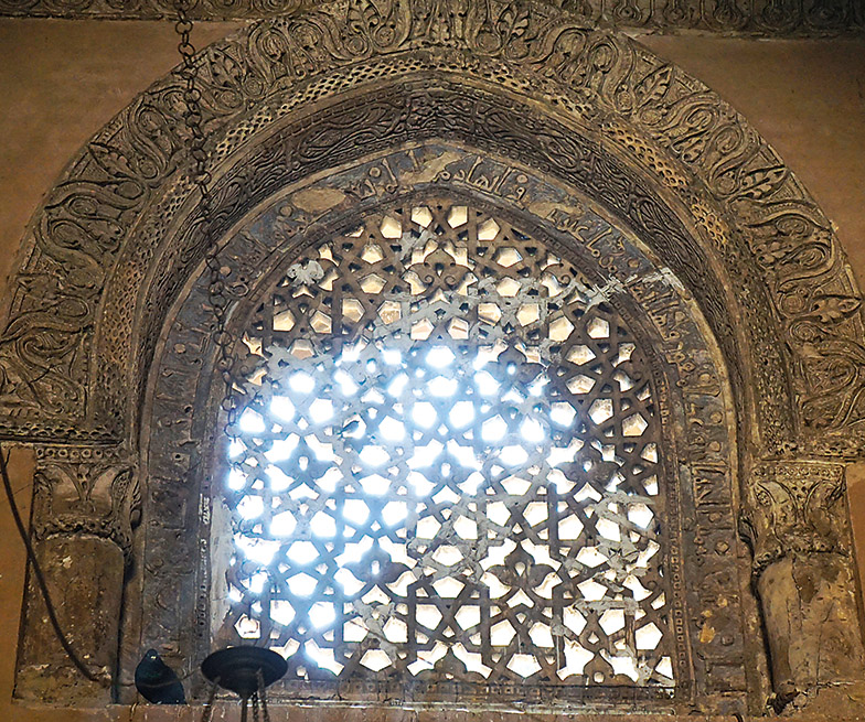 This pierced stone screen at the mosque of Ibn Tulun, Cairo, produced in the ninth century CE, sets a biomorphic, leaf design at the center of each 12-pointed star. 