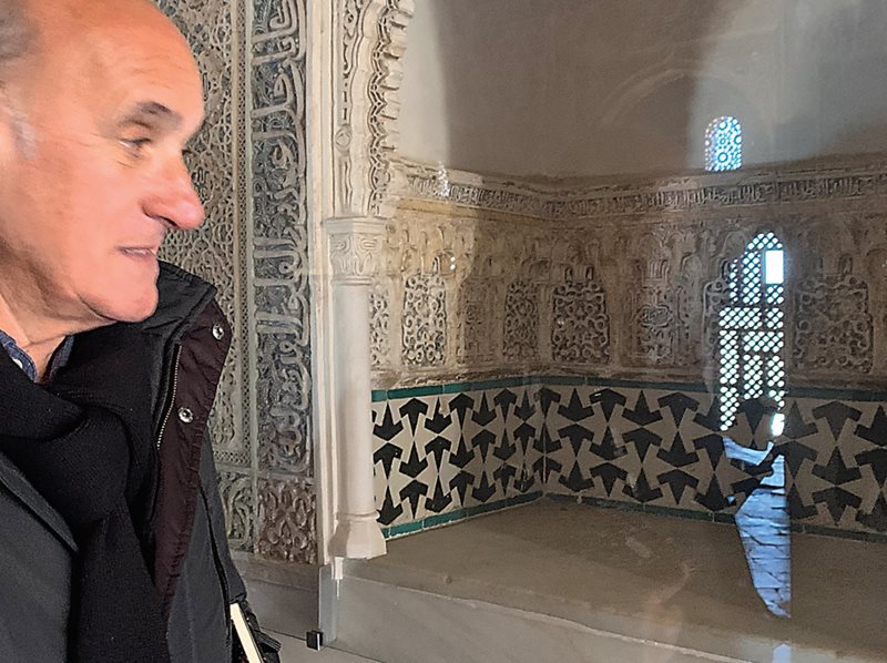 Mathematician Rafael Pérez-Gómez of the University of Granada points out the “tacas” motif on the lower wall of the Alhambra’s “Throne Room,” which Escher copied into his sketchbooks in 1936 and later that year used to structure his “Weightlifters” drawing lower right and, in 1957, included at the top right of this compilation of six patterns lower left.