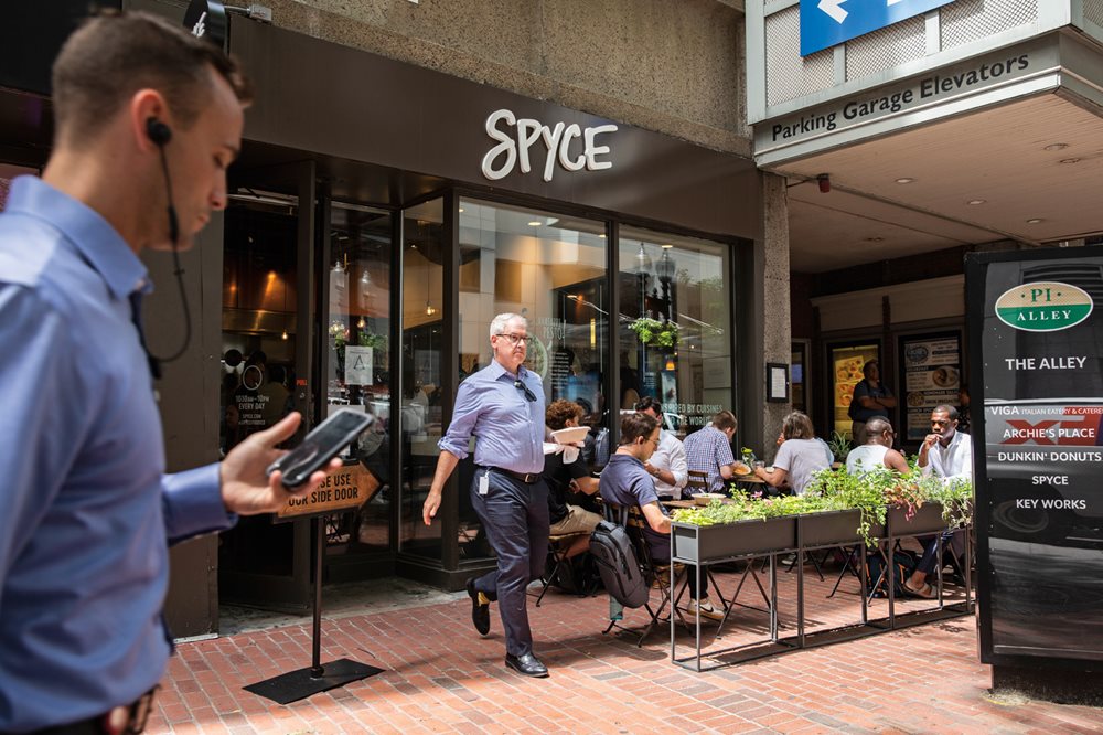 On a warm July afternoon in downtown Boston, the patio at Spyce is popular. 