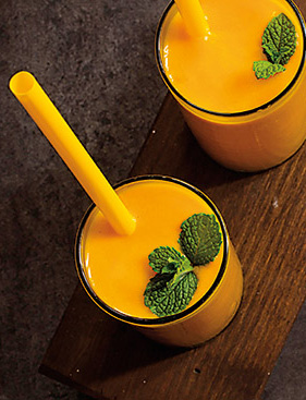 Mango lassi originated in the Punjab and Multan areas of India around 1000 BCE when fruits were first pureed with spices. Lassi, which can be sweet or savory, is sometimes called the world’s first smoothie: It is made of yogurt and fruit blended variously with water, spices, sugar and salt.