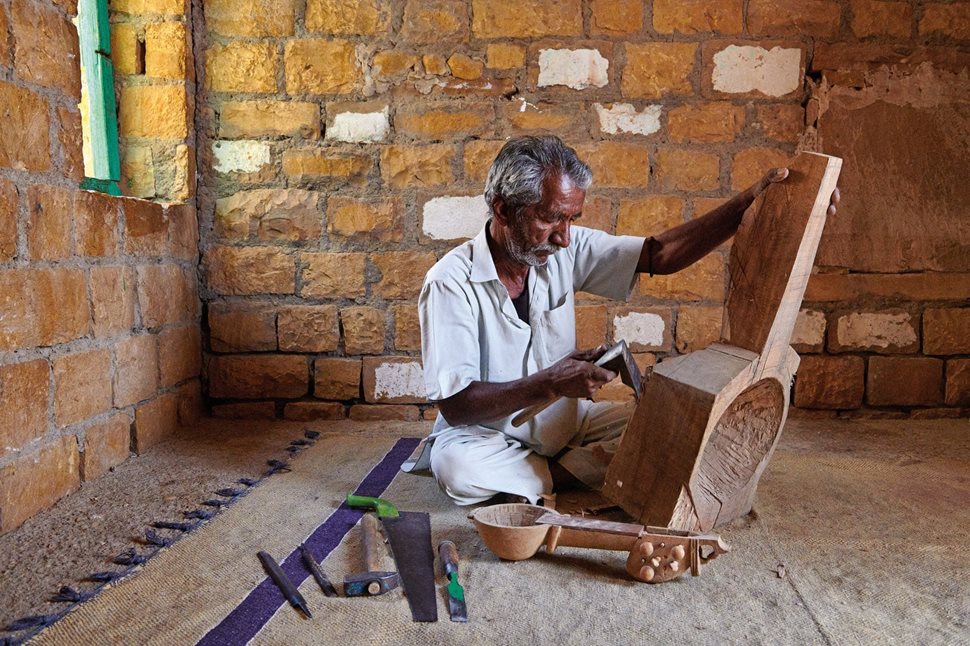 At his home workshop in Hamira, Rajasthan, kamaicha maker Shankara Ram Suthar carves out the frame of one of the oldest bowed-string instruments used by Manganiyar musicians.