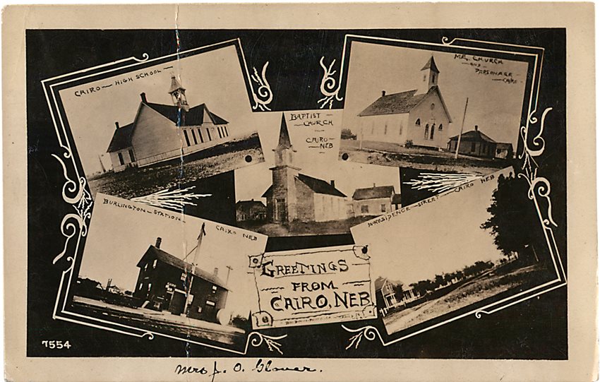  With a collage of the town’s buildings, including the high school, two churches, the railroad station and the main street, the sender of this card used its back to write, “It is so hot and dry if it does not rain soon the corn crop will be gone.” 