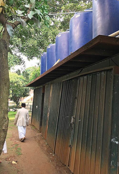 Tanks can hold up to 50,000 liters of rainwater collected from the roof for use in the mosque’s gardens, and a biogas tank buried under the courtyard generates cooking fuel. Solar panels, he says, are next.