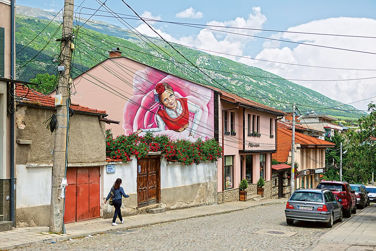 A mural in Karlovo shows a woman in traditional Bulgarian nosiya dress with a rose in her hair. The community’s connection to roses is rooted in its history and industry. According to Bulgaria’s National Statistical Institute, in 2020 the country exported nearly 1.5 tons of rose oil.
