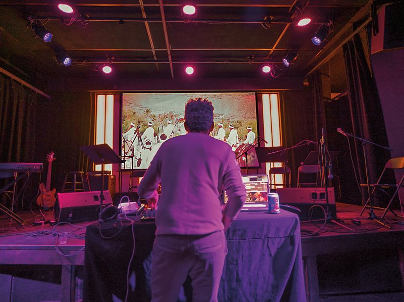 Warming up for his performance at Littlefield, Belyamani checks the venue’s audio and video settings. The video, he explains, brings the audience closer to the sources of the music and follows from Remix-Culture’s “mandate to honor the source and the context behind the music.”