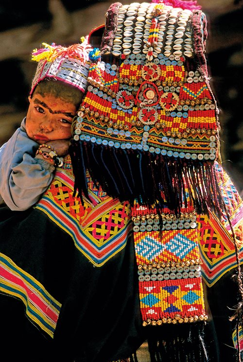 Iridescent and pearl-like buttons help adorn the elaborately woven and embroidered textiles made by women in Pakistan&#39;s far-northern district of Chitral&mdash;one of many decorative uses around the world that may faintly echo early uses of buttons to the south in the Indus Valley.&nbsp;