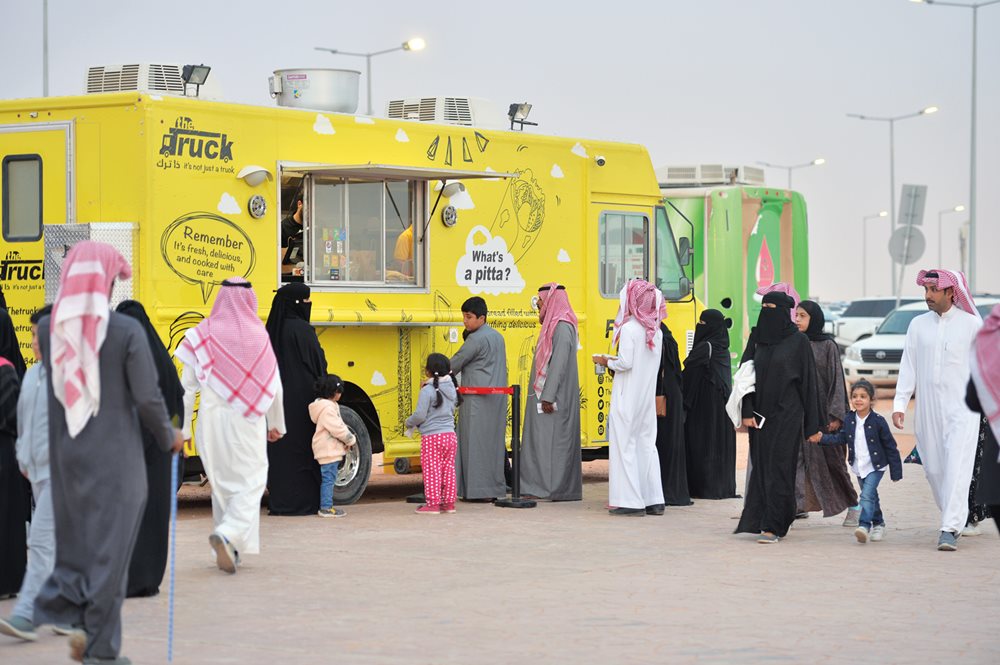 Hungry attendees line up at &ldquo;The Truck&rdquo; for camel burgers (with french fries, of course) at the King Abdulaziz Camel Festival.