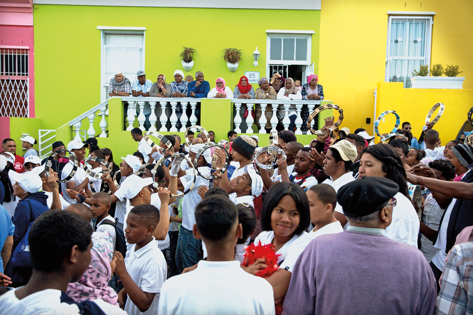 Generations of Bo-Kaap residents enjoy music and dance during the annual Heritage Festival 5KM Family Fun Walk, which parades through the neighborhood on September 24, Heritage Day.