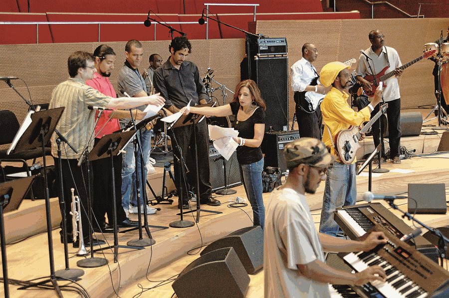 Elder hands out music for a July 2008 show in Millennium Park, Chicago, that reunited artists from Sudan and South Sudan, accompanied by the African Birds and members of the Chicago Symphony.