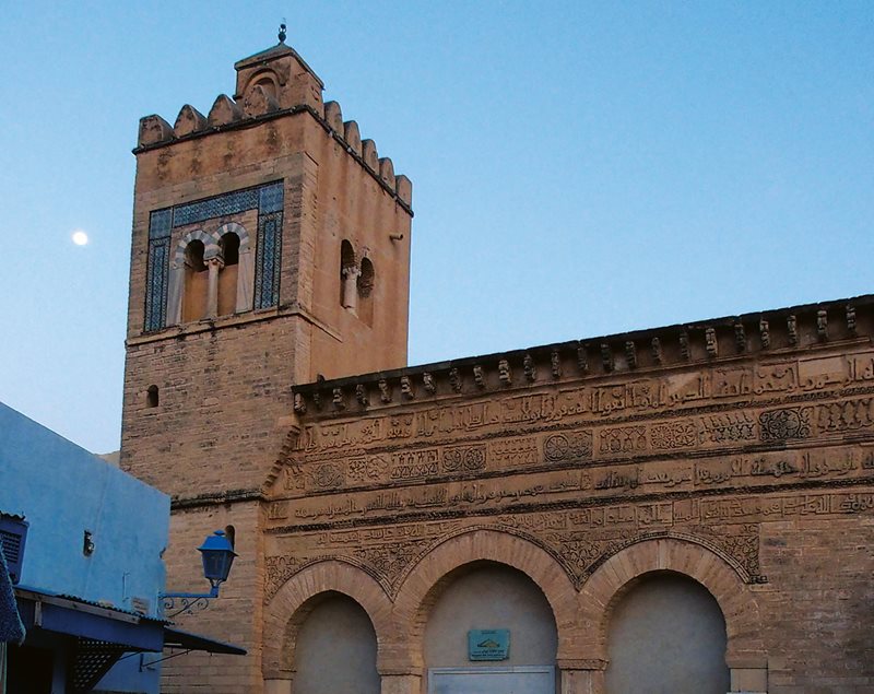 Arabic sculpted in Kufic script, rosettes and vegetal designs dating from 866 ce make Kairouan’s Mosque of the Three Doors a virtual catalog of Aghlabid motifs and the oldest Islamic ornamental facade standing today.