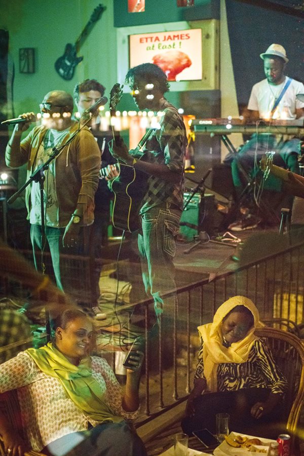 Residents enjoy reggae at a Khartoum music club.