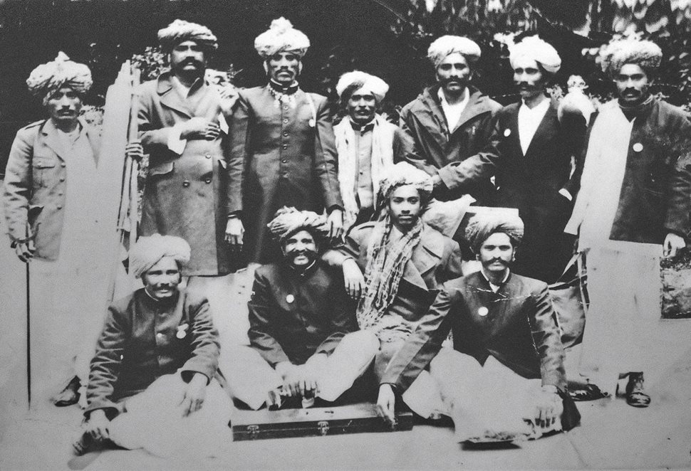 Top A group of Rajasthan’s premier Langa and Manganiyar musicians traveled to London, England, to perform in 1983, including Sakar Khan Manganiyar, pictured top row, second from the right. and below. He is considered the greatest kamaicha player of his time and was the first Manganiyar to receive the Padma Shri award, one of the highest civilian awards of India.