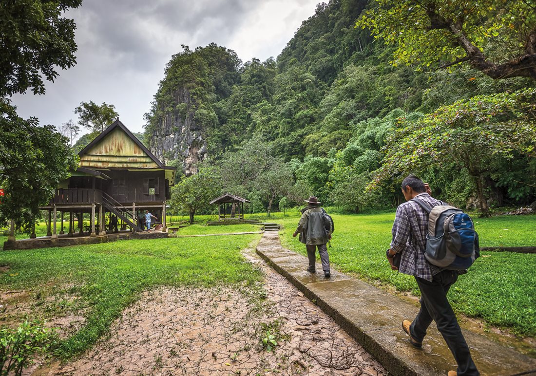 Archeologists Muhammad Ramli and Mubarak Andi Pampang, who work for the Centre for the Preservation of the Cultural Heritage of Makassar, capital of South Sulawesi, arrive at the shelter that serves as a &nbsp;base camp for research in the Leang-Leang Prehistoric Park where a sign, below, points to a cave: Leang means &ldquo;hole&rdquo; or &ldquo;cave.&rdquo;&nbsp;