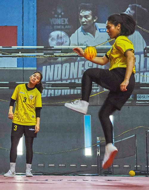 Indonesian national women’s sepak takraw team members practice ahead of the Southeast Asian Games, from which they took home a silver medal. 