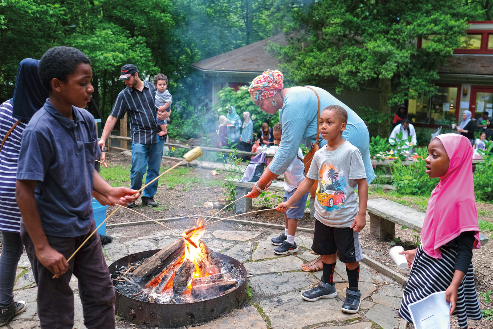 On a warm June evening, people gathered at a park in Bethesda, Maryland, for a community potluck dinner welcoming the start of Ramadan.