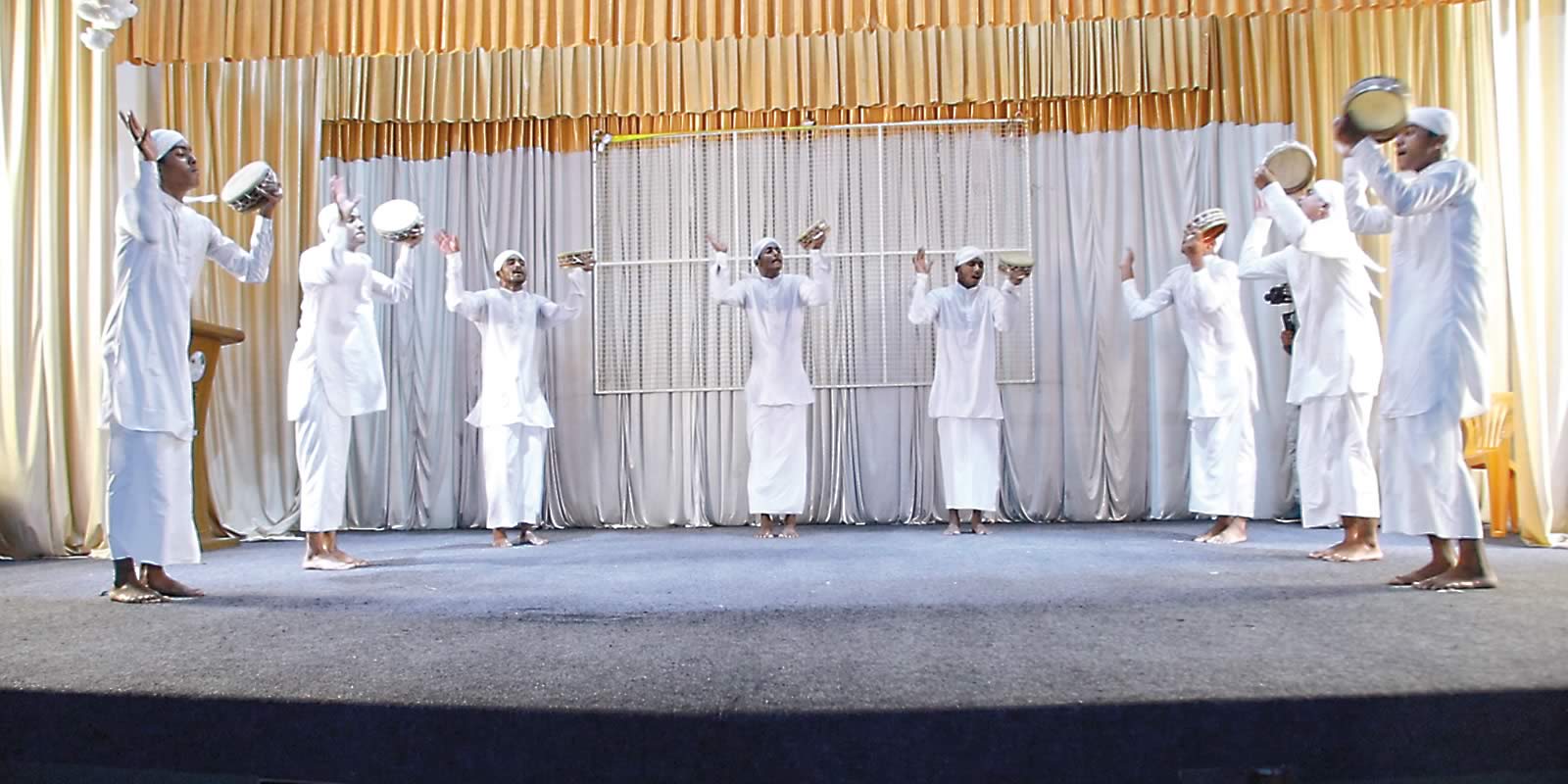 On stage in the town of Tirurangadi performers present a duff muttu, a devotional genre that celebrates God and the Prophet Muhammad, using voices and hand-held drums. 