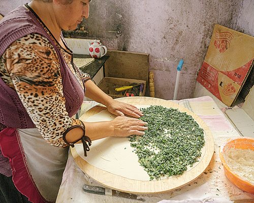In Dashkasan a local makes traditional herd qutab with spinach, cheese and lots of butter.