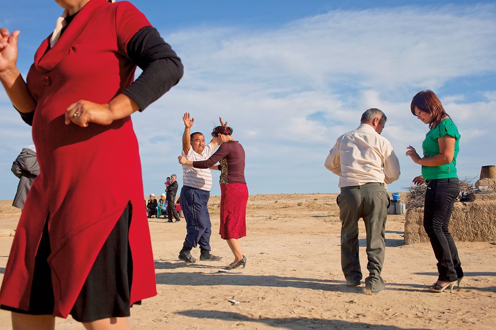 <p>Along the shore of the North Aral Sea, a wedding gives an occasion for a dance in the village of Tastubek, where fish catches are rising with sea levels.</p>
